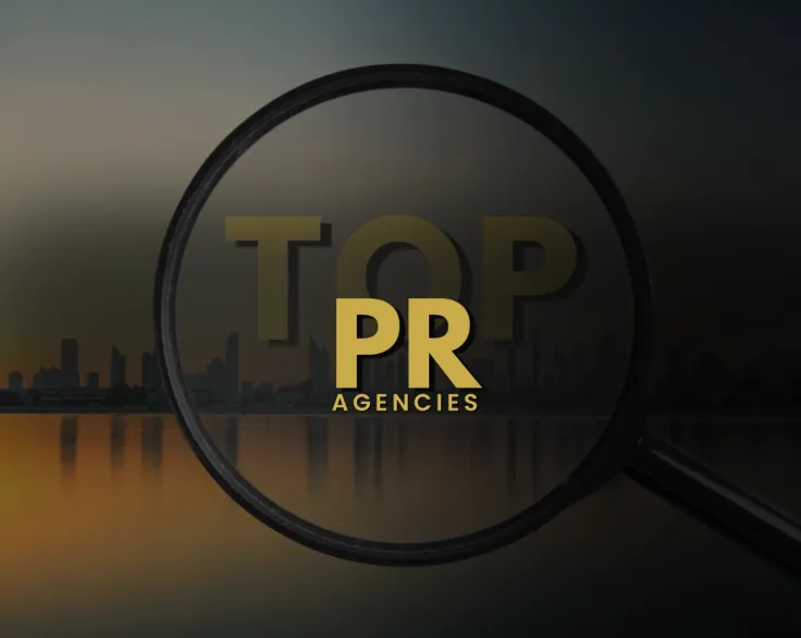 Magnifying glass over text that reads "TOP PR AGENCIES"