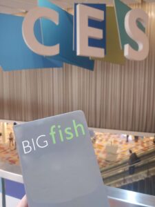 BIGfish logo notebook in front of CES sign at CES 2023